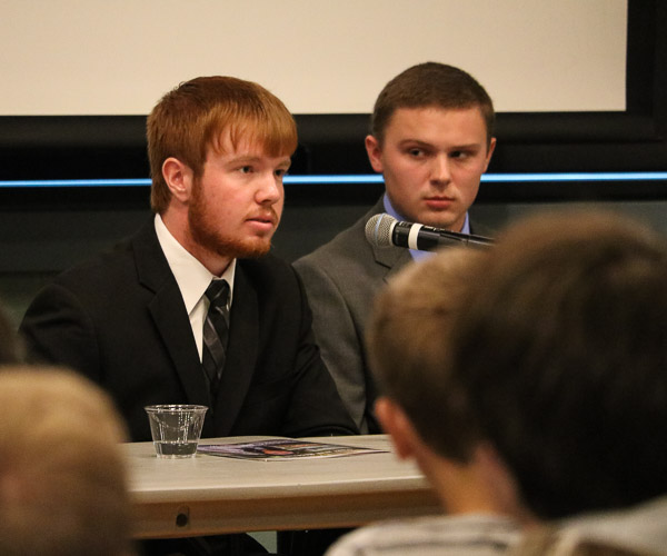 Taylor B. Leitzell, an accounting student from Beach Creek, takes the mic. The student panel addressed topics ranging from the high school-to-college transition to time management and social activities. On right is student Kyle M. Landis, of Troy, who majors in business administration: banking and finance concentration.