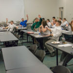 Chef Paul Mach, assistant professor of hospitality management/culinary arts, initiates a sausage-related straw poll.