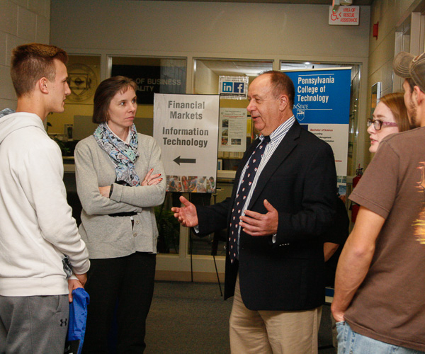 Business faculty members Tammy M. Rich and Steven J. Moff (center) share their majors' career potential.