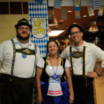 Donning lederhosen, a dirndl and other apt attire are (from left) Dining Services' Christopher R. Grove, manager; Kathleen A. Pfirman, catering attendant; and Jonathan T. Hall, assistant manager.