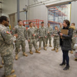 Central PA Food Bank volunteer coordinator Cydne Shull gives the cadets a tour of the facility on Wahoo Drive.