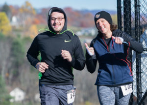 Shiny, happy, chilly runners: college employees Anthony Pace and Kimberly Cassel make the most of their Saturday.