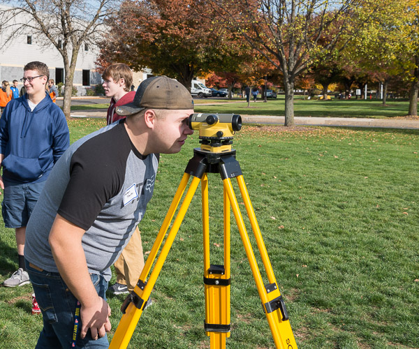 A high school student gets a close-up view of the latest in surveying equipment.