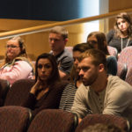 Students listen to working-world advice from business graduates and other business professionals.
