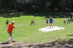Curt Vander Vere swings at a pitch from Anthony V. Rode while playing baseball with Cuban youngsters near Ernest Hemingway's house in suburban Havana.
