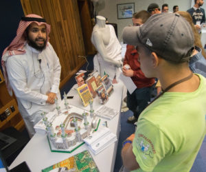 Omar A. Aljallal, a plastics and polymer engineering technology major, takes visitors on a journey to the Muslim holy cities of Mecca and Medina.