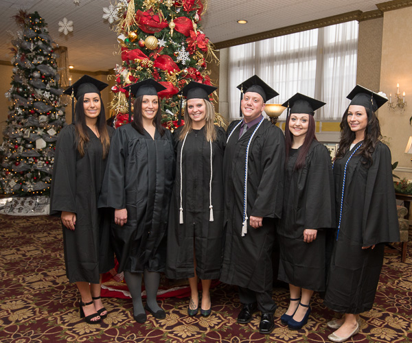 Nursing graduates make use of The Genetti Hotel's adorned lobby for a parting shot. 