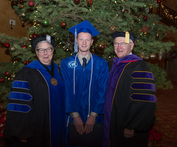 The student speaker enjoys a pre-ceremony moment with the college president and board of directors chairman. 
