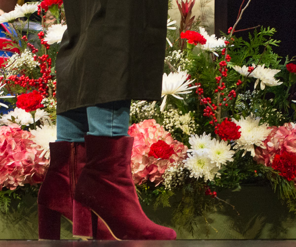 ... and perfectly complement this graduate’s red suede boots.