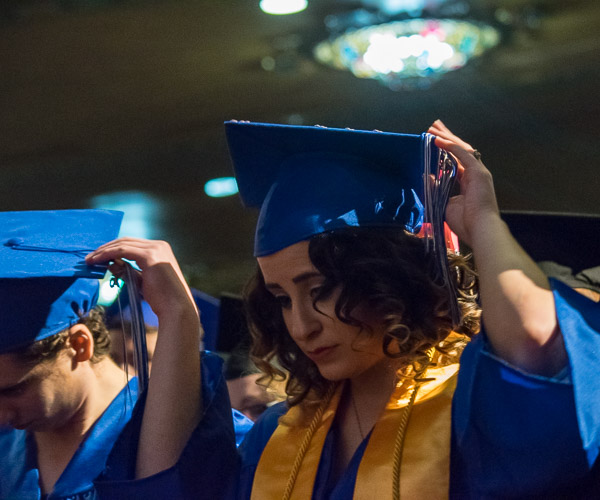 Associate-degree graduates turn their tassels, making it official.