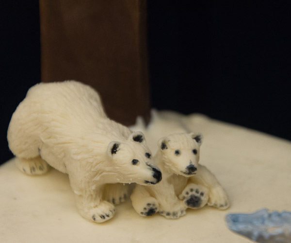- … whose chocolate-sculpted polar bears explore an icy plateau. 