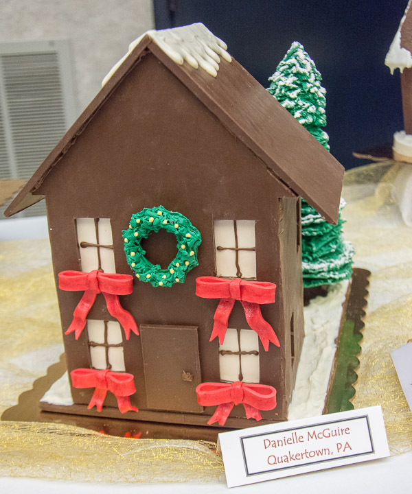A festively adorned chocolate house by Danielle M. McGuire takes third place in Principles of Chocolate Works.