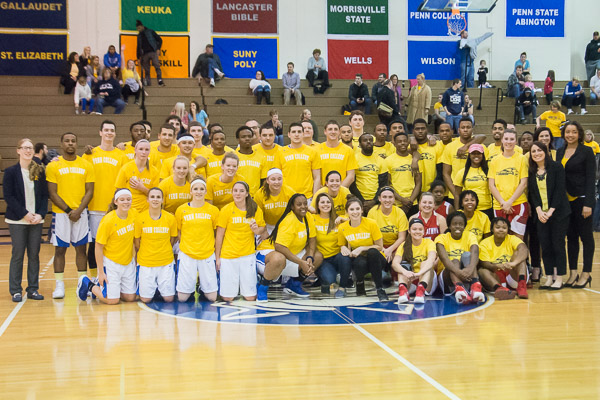 A common cause turns adversaries into allies: The Penn College Wildcats and Bryn Athyn College Lions gather in solidarity (and the night's signature color).