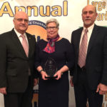 President Davie Jane Gilmour accepts the 2017 Williamsport/Lycoming Chamber of Commerce President’s Award from Vincent J. Matteo (left), Chamber president/CEO, and Roger D. Jarrett, chairman of the Chamber Board.