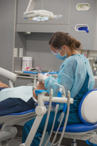 Kayla M. Brensinger, a dental hygiene student from Altoona, works with a client in Penn College’s Dental Hygiene Clinic. Services available to the community include cleanings, exams, sealants and X-rays.