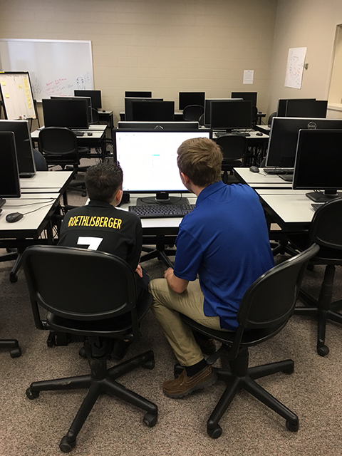 Temoshenko and Mitchell get down to business in the college’s gaming and simulation lab.