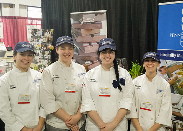 Penn College students (from left) Erica L. Breski, of Harrisburg; Katlyn J. Hackling, of Williamsport; Keegan D. Sonney, of Erie; and Merissa N. Aucker, of Middleburg, staffed the college’s booth at the Philadelphia National Candy, Gift and Gourmet Show, where they prepared bonbons and discussed the college’s hospitality programs.