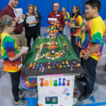 Judges talk with the tie-dyed architects of "Totally Turbular."