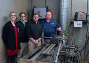 Hypertherm is entrusting equipment to Penn College for instructional use in its welding program. From left are Elizabeth A. Biddle, director of corporate relations at Penn College; Brent Malik, regional sales manager for Hypertherm; Max Williams, district sales manager for Hypertherm; and Dave Cotner, dean of industrial, computing and engineering technologies at Penn College.