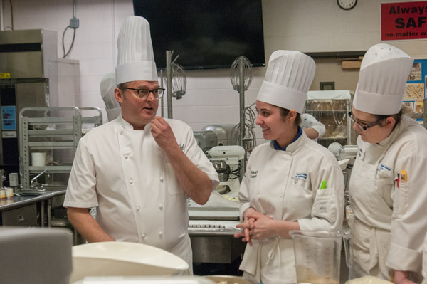Baking and pastry arts students Alexis L. Kepley, of Reading, and Amber A. Kreitzer, of Port Trevorton, absorb instruction from Chef Donald Wressell.