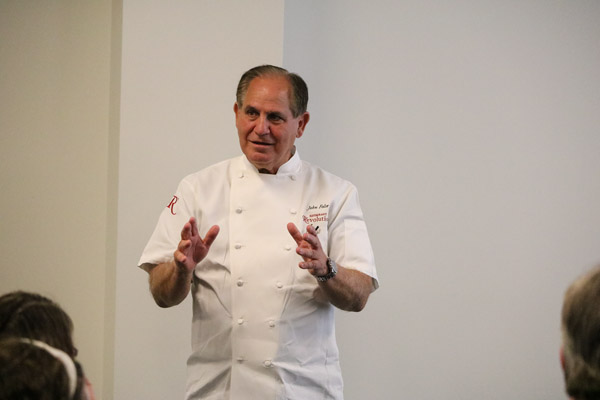 Chef John Folse shares with students and faculty how humble beginnings as a child of eight “with mud between my toes” on the swamps of Louisiana, where his widower father was a fur trapper, led to becoming a well-known restaurateur on the international stage.