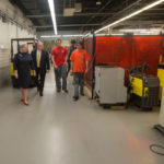 President Davie Jane Gilmour escorts Sen. Wagner through the welding labs with the assistance of welding students Thomas (“TJ”) J. Sneeringer (in red) and Joseph (“Joey”) M. Taylor, both of Hanover. 