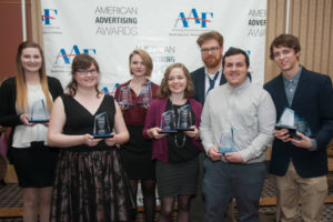 Award-winning Penn College graphic design students are, from left: Nicole A. Kunze, Eliza R. Whyman, Ainsley R. Bennett and Morgan N. Keyser; instructor Nicholas L. Stephenson; and students Zachary T. DiAntonio and Todd R. Surkovich.