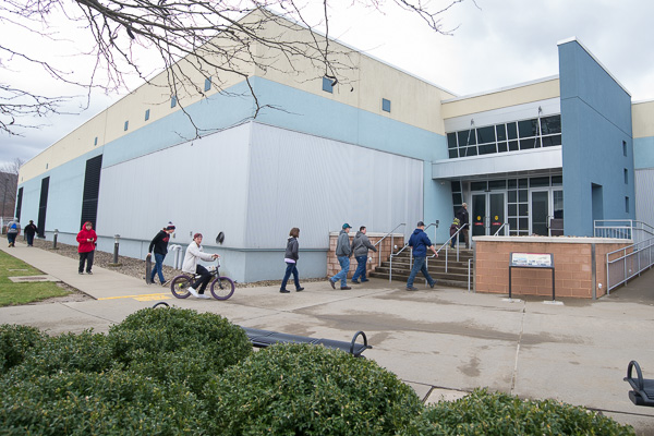 Open House guests walk – and roll – into College Avenue Labs on a brisk spring day. 