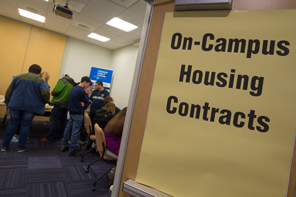 The room designated for on-campus housing contracts was a busy one. 