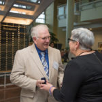 Carl N. Beaver, an inductee to the Pillar Society, receives a pin and appreciation from the president. 