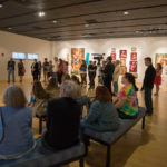 Interested patrons fill the gallery space for the artist’s talk. 
