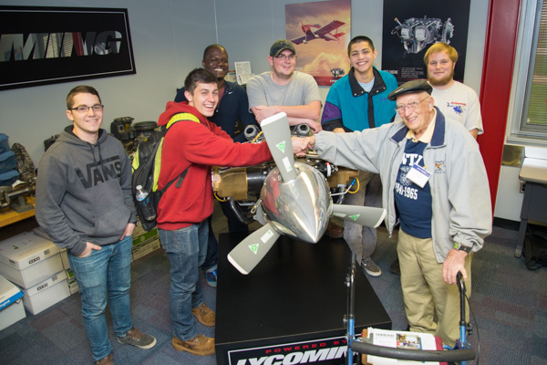 Eugene C. Breiner, ’44, aviation – whose connection to the campus was featured in the Summer 2011 issue of the college magazine – is joined by current aviation students. 