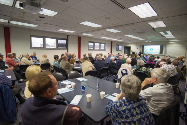 A “full house” listens to President Gilmour’s comments, which included deep appreciation for helping to form the college’s foundation. 