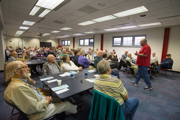 In his red Patriot Scholarship T-shirt, Beaver discusses various veterans affairs topics.