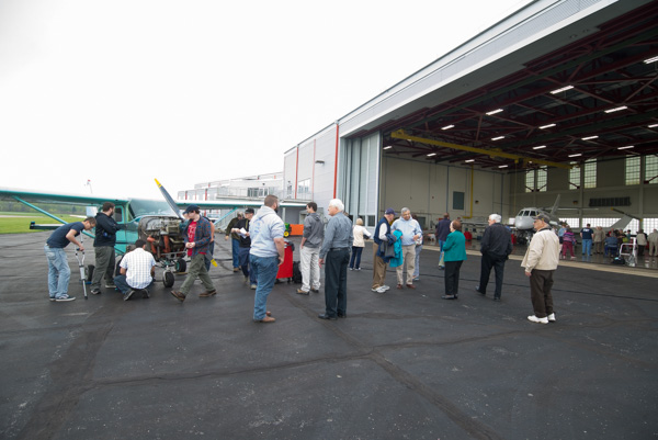 The tour moves out onto the tarmac where aviation students engage in lab work. 