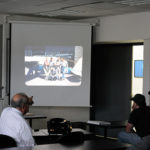 Proudly pointing out a slideshow version of his younger self, kneeling at the airport