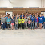 After a morning of hands-on learning that would make any parent proud, the group gathers for a photo.