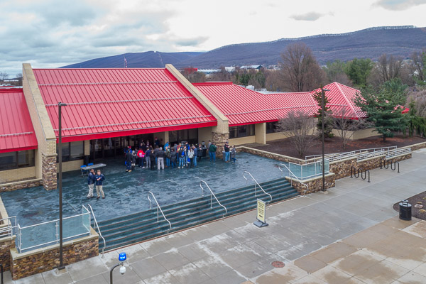 The heated LEC patio, which made quick work of winter's recent worst, adds a patch of blue in this drone's-eye view.
