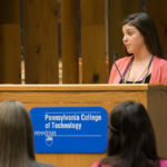 Kayla A Gross, chapter president amd treasurer, presides over the induction.