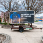 A billboard outside the ACC stresses the importance of QPR Training (Question, Persuade and Refer) in reading the warning signs of emotional crisis.