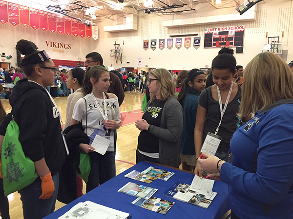 Stacey C. Hampton (center), assistant dean of industrial, computing and engineering technologies, inspires young women at the daylong event.
