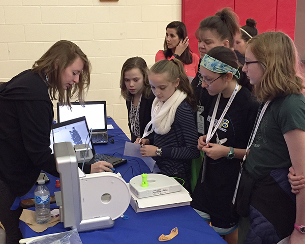Engineering design technology student Catherine E. Weatherman, of Ringtown, engagingly serves as an ambassador for her chosen field. (Though not pictured, classmate Shannon R. Knarr, of Trevorton, joined in the instructive fun.) 