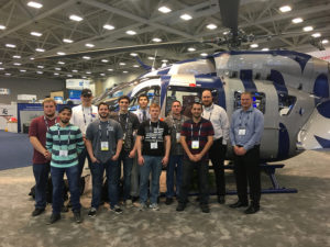 From left are students Noah J. Ansell, David A. Gadalla, Ryan P. Biichle, Patrick M. Murray, Zachary D. Reese, Samuel J. Pham and Dennis J. McNamara; faculty members William Stepp III and William Stepp IV; and alumni Gregory B. Gilliland ('06 and '08) and Jason M. Smith ('06). Gilliland is lead mechanic for Metro Aviation and Smith is general manager at Sterling Helicopters.