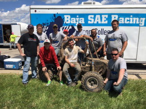Members of the Penn College team proudly pose with their car after finishing fifth out of 107 schools in the four-hour endurance race at Baja SAE Kansas. From left are: John G. Upcraft, faculty adviser; Logan B. Goodhart, of Chambersburg; Mark A. Turek, of Red Lion; Jonathan R. Sutcliffe, of Orangeville; Matthew J. Nyman, of Lock Haven; Johnathan T. Capps, of North Wales; Trevor M. Clouser, of Millmont; Shujaa AlQahtani, of Saudi Arabia; Darian P. Trego, of Mifflinburg; and Clinton R. Bettner, of Beaver Falls.