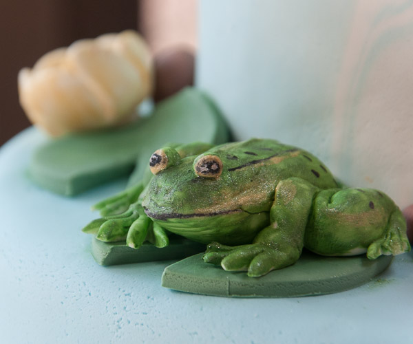 Handcrafted, edible frogs adorn Rachel A. Henninger’s cake.