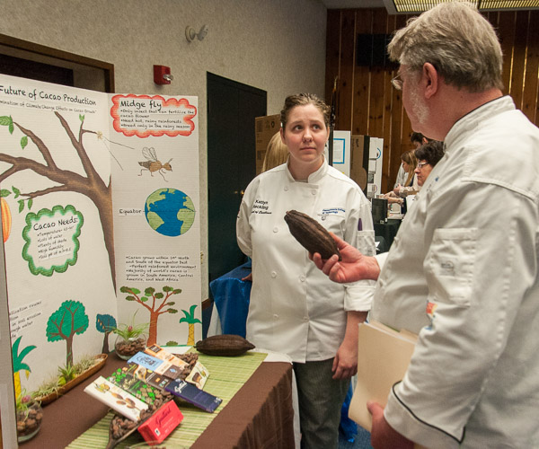 Katlyn J. Hackling, of Williamsport, discusses her research into “The Future of Cocoa Production,” including the effects of climate change and industry practices, with Chef Frank M. Suchwala, associate professor of hospitality management/culinary arts.