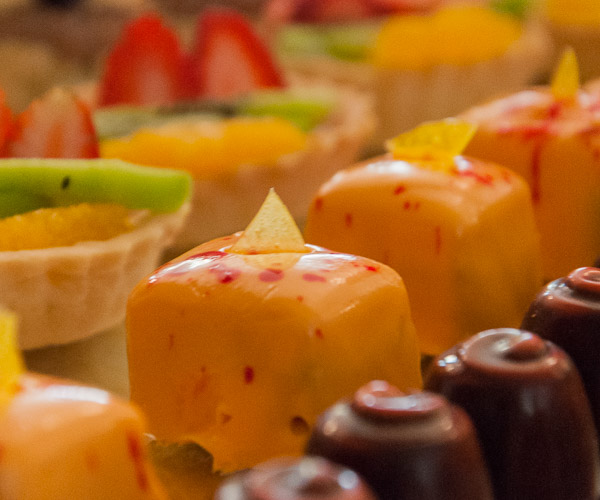 Monborne tempts attendees with fresh-fruit tarts, apricot/strawberry petit fours and “orange dream” truffles.