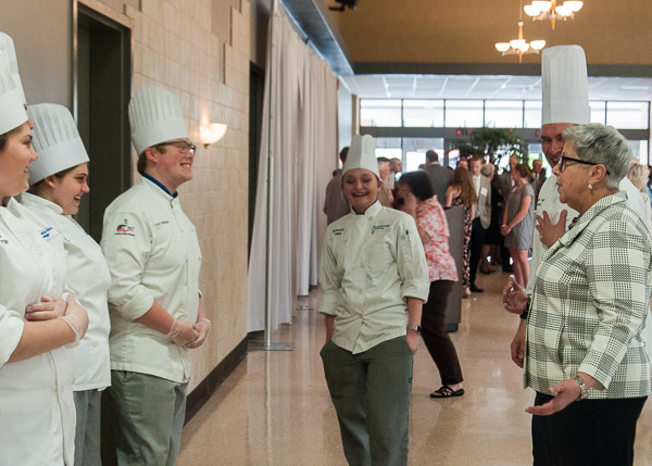 President Davie Jane Gilmour elicits laughter during a pre-event chat with students.