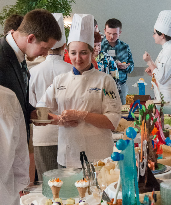 Amid a long line of tasty desserts, Settle learns more about the options from Weakland.