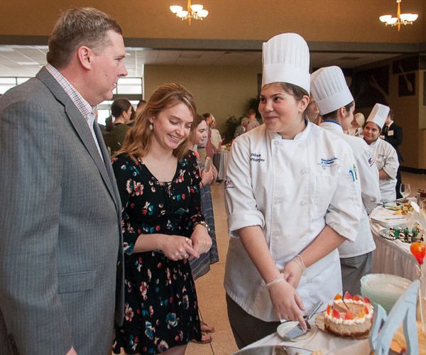 Elliott Strickland, chief student affairs officer, and student development officer Lauren J. Crouse, an applied human services student, delight in the tasty descriptions offered by Solenberger.